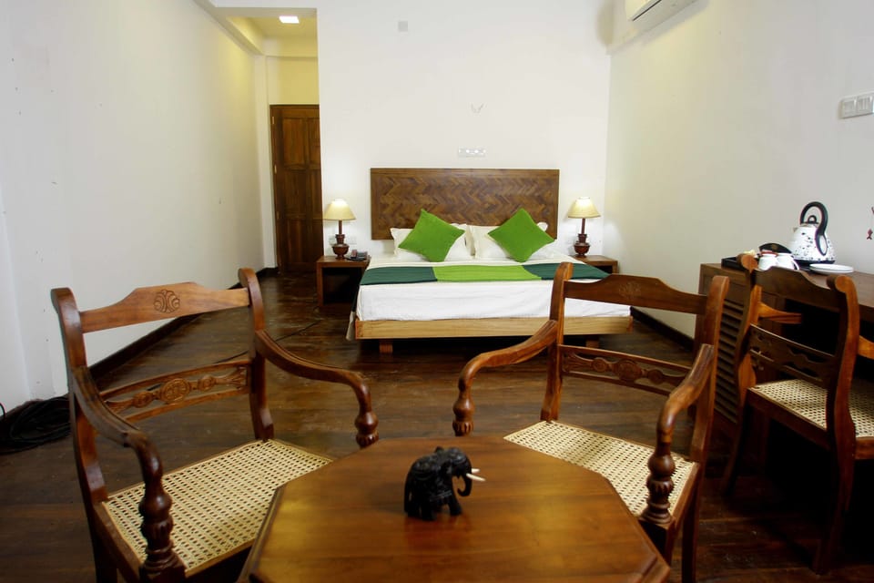 Deluxe Double or Twin Room, Pool View | Minibar, in-room safe, desk, iron/ironing board