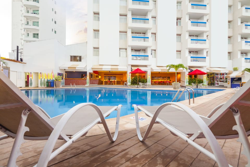Outdoor pool, open 9:00 AM to 8:00 PM, pool umbrellas, sun loungers