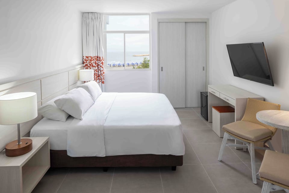Premium bedding, down comforters, in-room safe, iron/ironing board