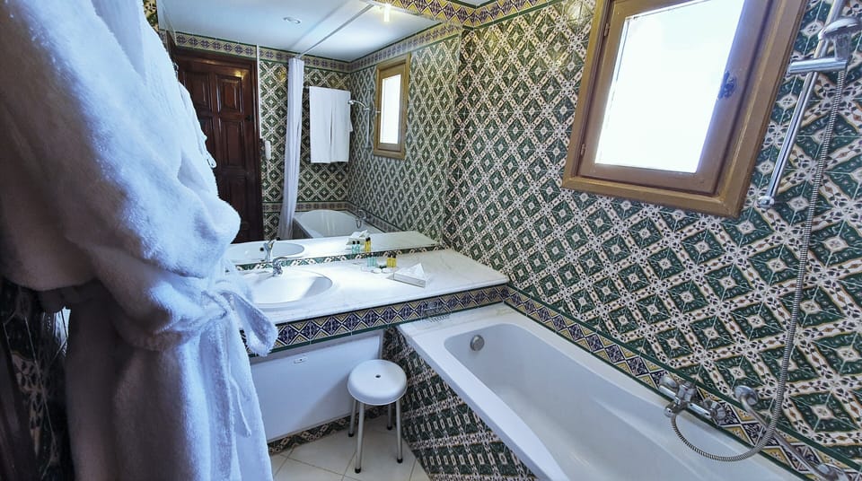 Combined shower/tub, hair dryer, bathrobes, towels