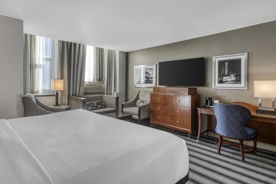 Deluxe Suite, 1 King Bed, Non Smoking, Refrigerator (with Sofabed) | Pillowtop beds, in-room safe, desk, laptop workspace