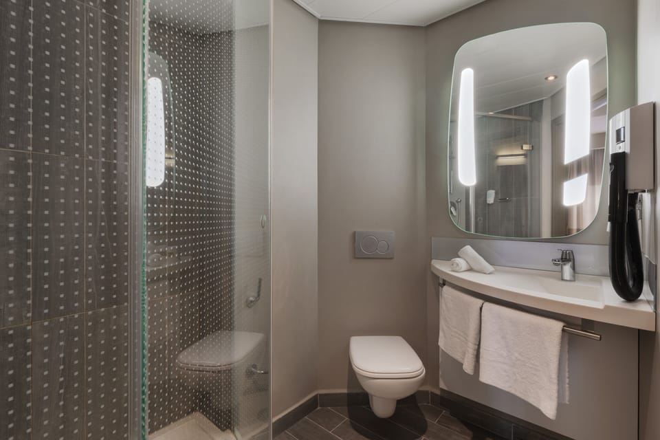 Shower, eco-friendly toiletries, hair dryer, towels