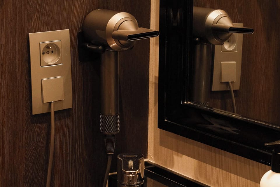 Courtyard room | Bathroom | Designer toiletries, hair dryer, bathrobes, slippers