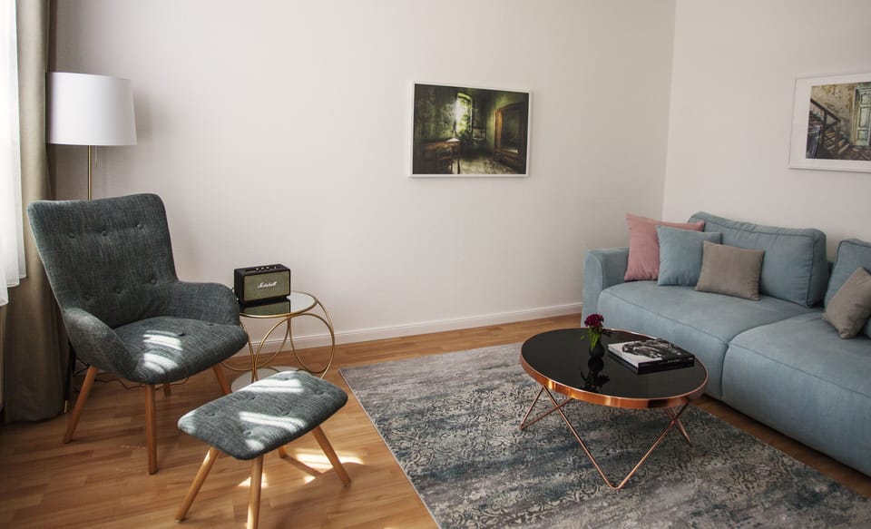 Deluxe Apartment, 1 King Bed | Living room | Flat-screen TV