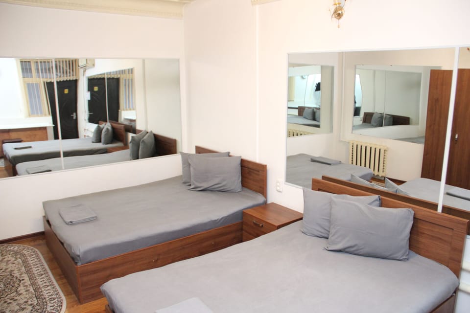 Economy Double Room, 2 Double Beds | In-room safe, blackout drapes, WiFi (free), bed sheets