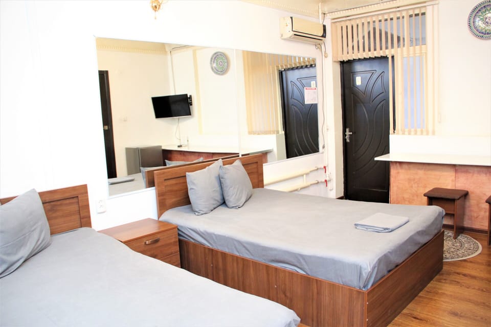Economy Double Room, 2 Double Beds | In-room safe, blackout drapes, WiFi (free), bed sheets