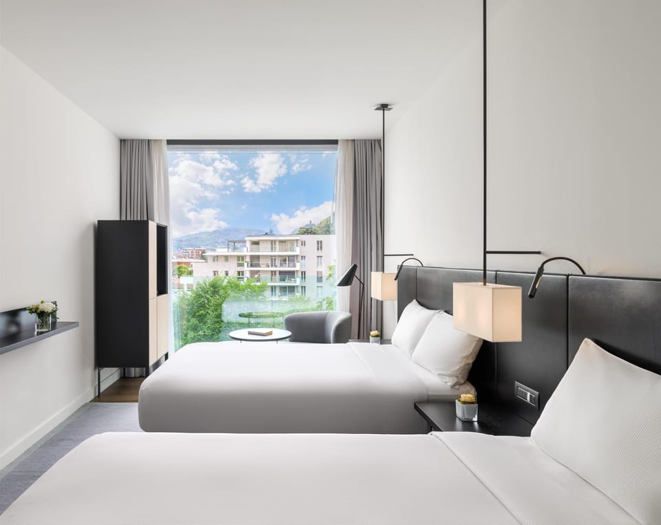 Deluxe Room, 2 Twin Beds, City View | Down comforters, in-room safe, individually furnished, desk