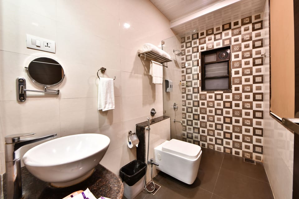 Family Suite, 1 Double Bed | Bathroom | Shower, rainfall showerhead, designer toiletries, slippers