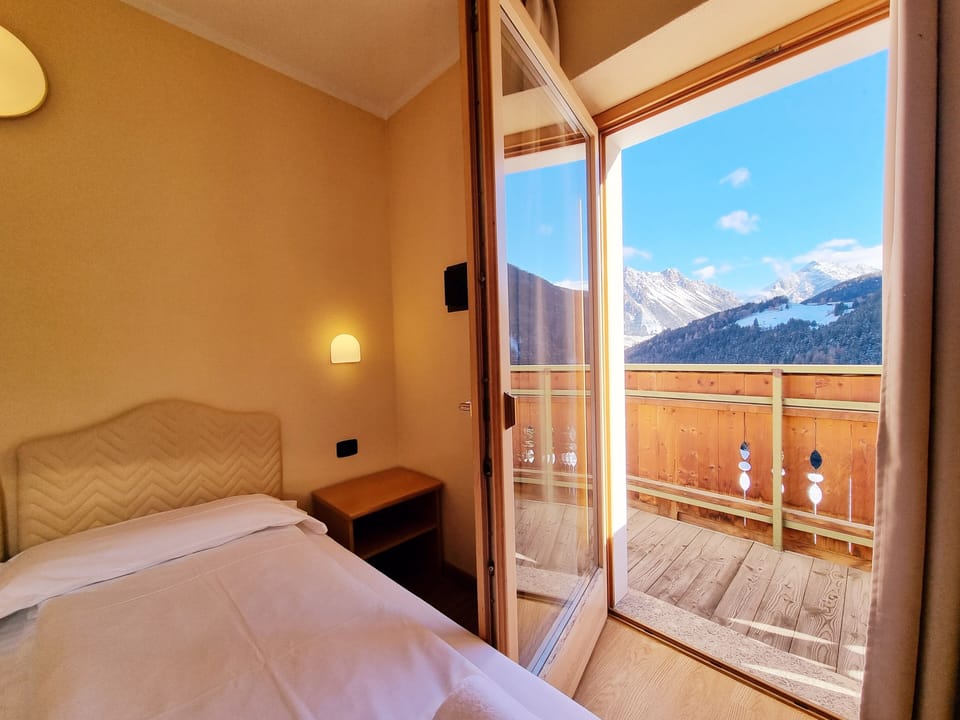 Deluxe Room, Terrace, Mountain View | Hypo-allergenic bedding, down comforters, in-room safe, desk
