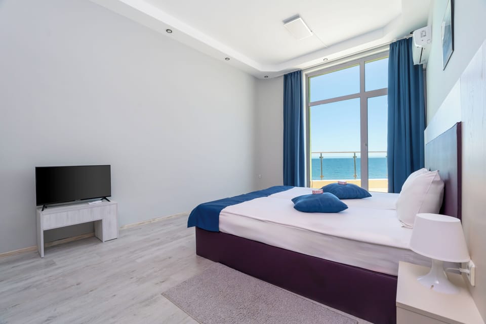 Two Bedroom Suite | Desk, blackout drapes, iron/ironing board (on request), cribs (free)