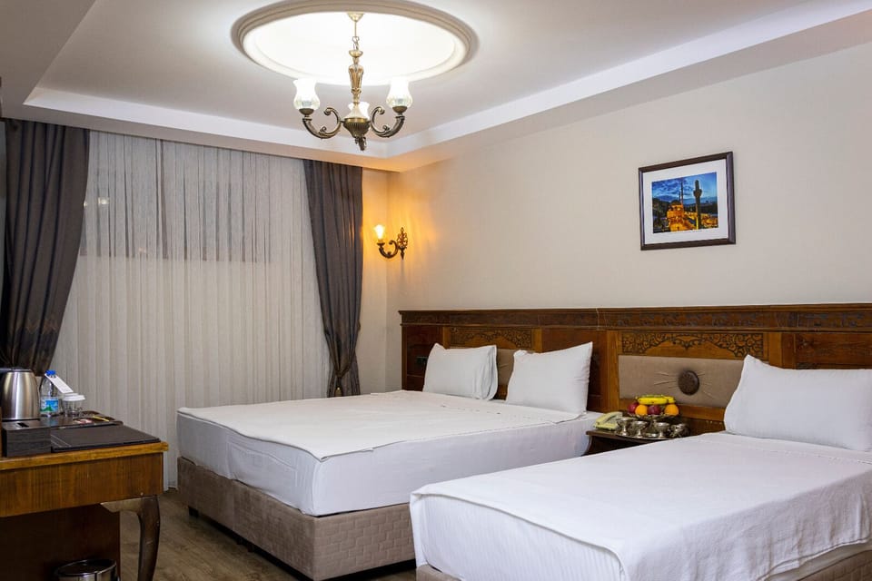Triple Room | Minibar, in-room safe, desk, soundproofing