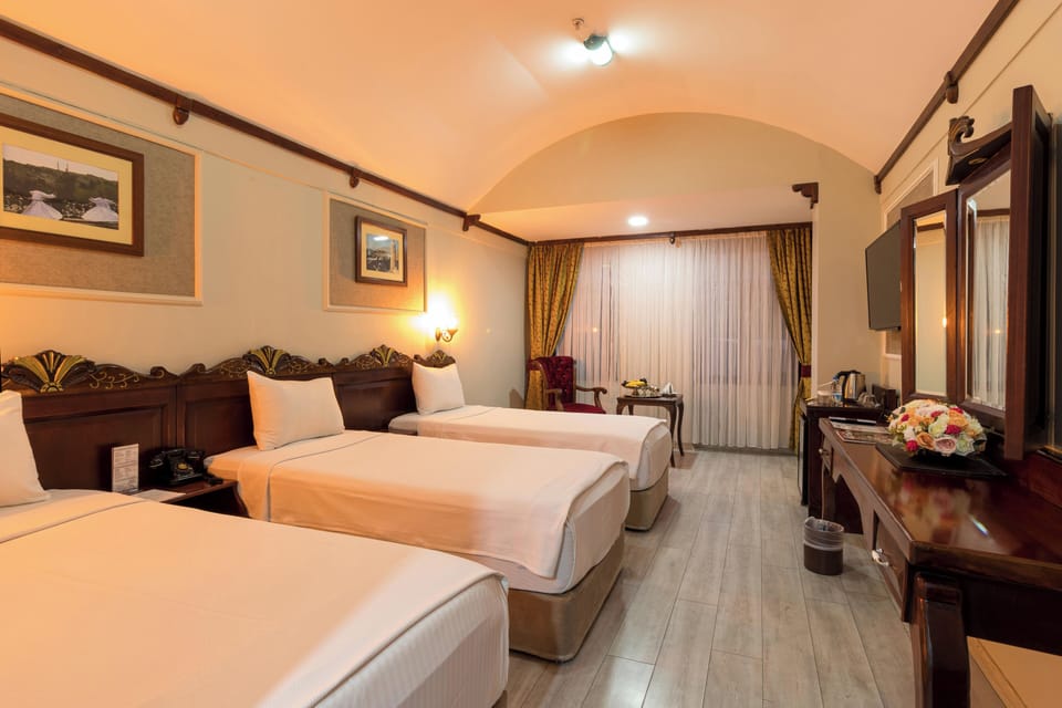 Triple Room | Minibar, in-room safe, desk, soundproofing