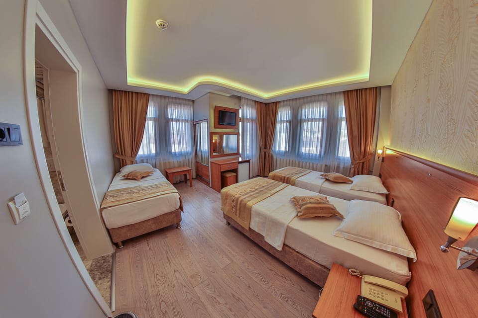 Classic Triple Room, Sea View | Minibar, desk, rollaway beds, free WiFi
