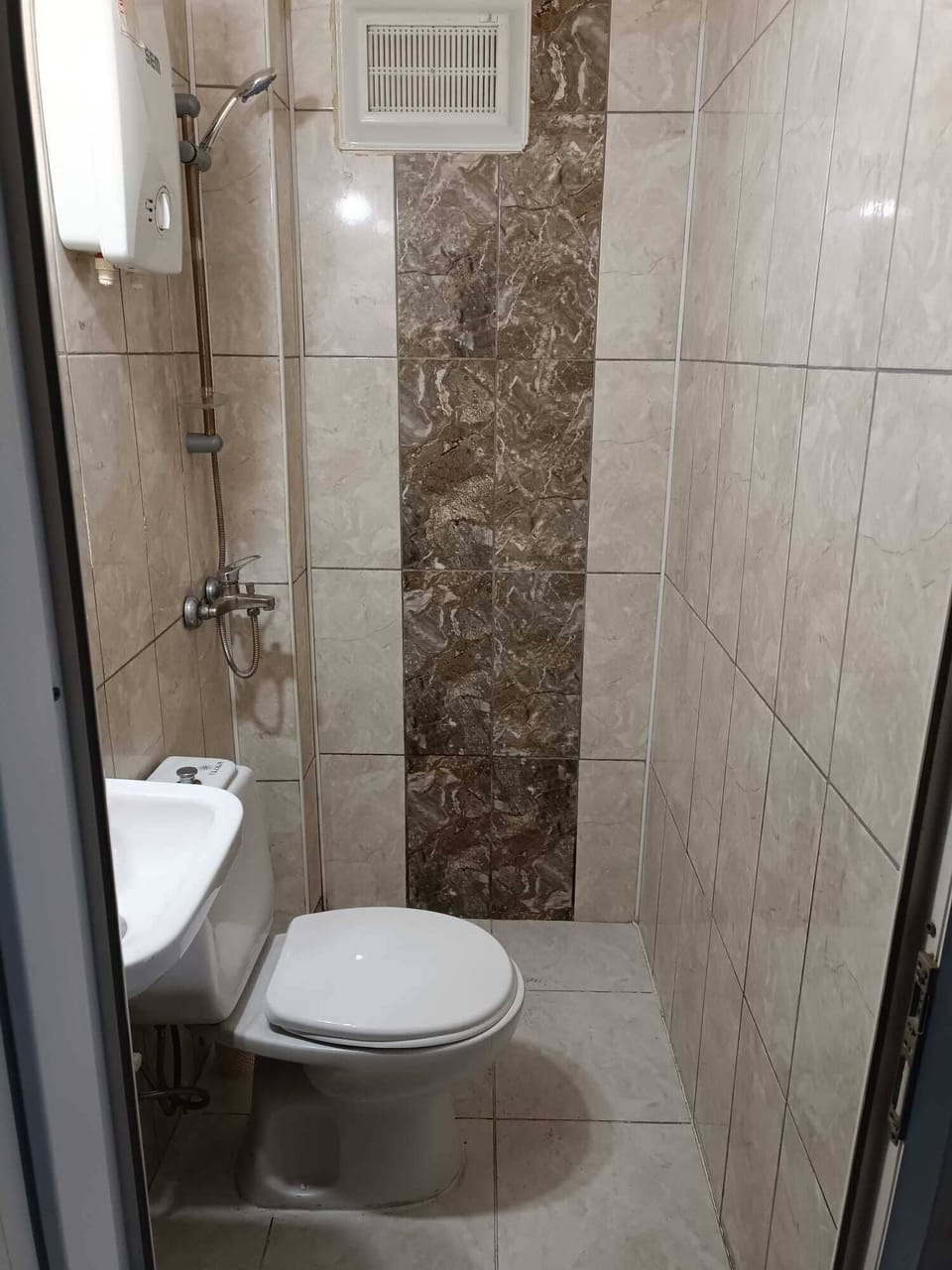 Shower, free toiletries, hair dryer, slippers