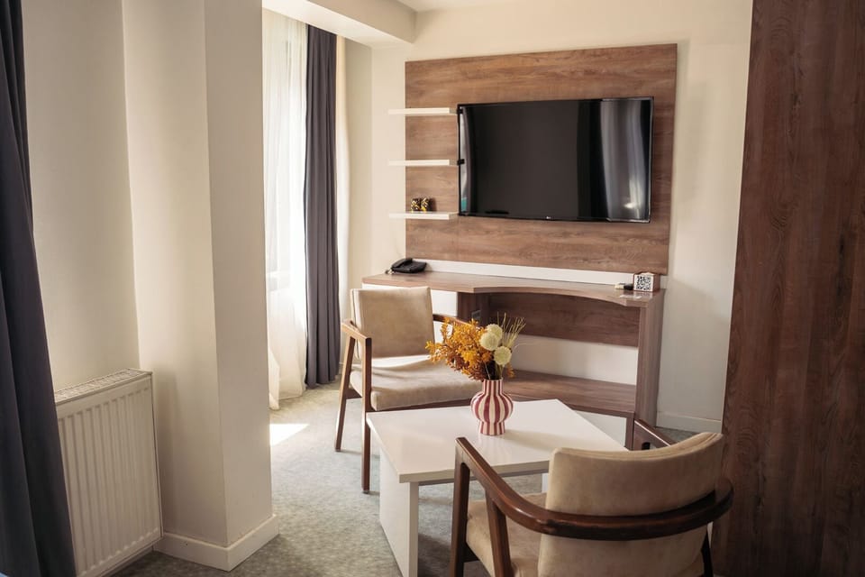 Deluxe Double Room | Minibar, desk, laptop workspace, blackout drapes