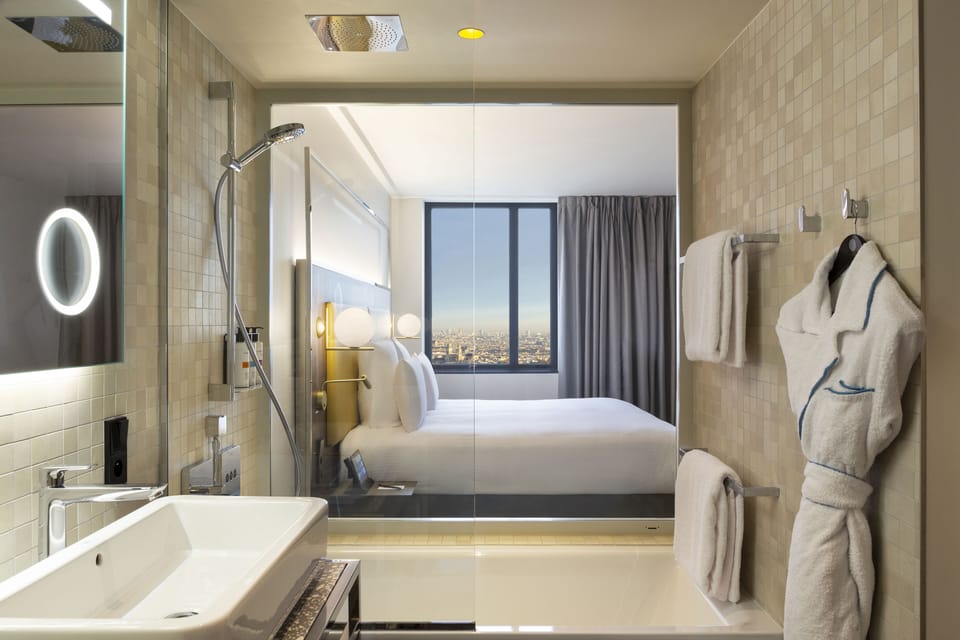 Deluxe Suite, 1 King Bed with Sofa bed (Paris View) | Bathroom | Eco-friendly toiletries, hair dryer, bathrobes, slippers