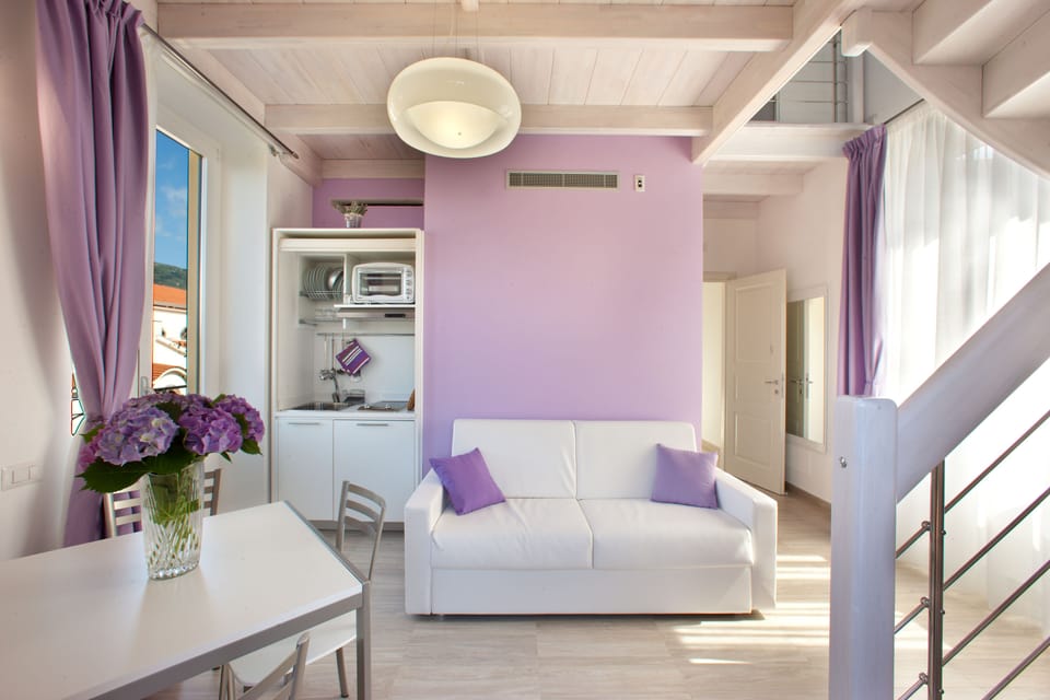Deluxe Duplex, Sea View (Lavanda) | Living room | Flat-screen TV