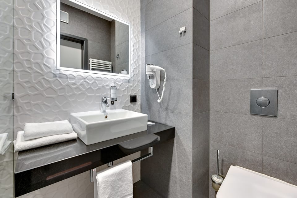 Family Studio | Bathroom | Shower, hair dryer, towels