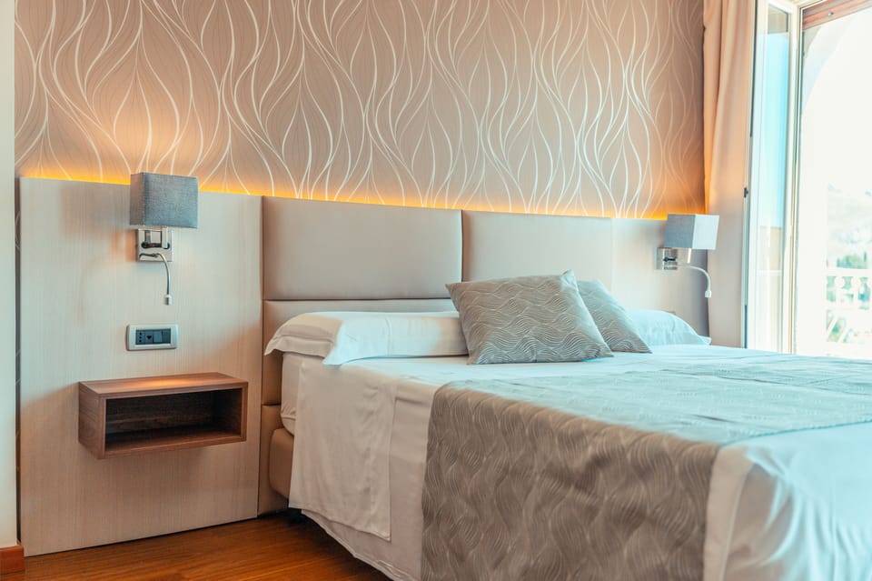 Deluxe Double or Twin Room | Minibar, in-room safe, desk, laptop workspace