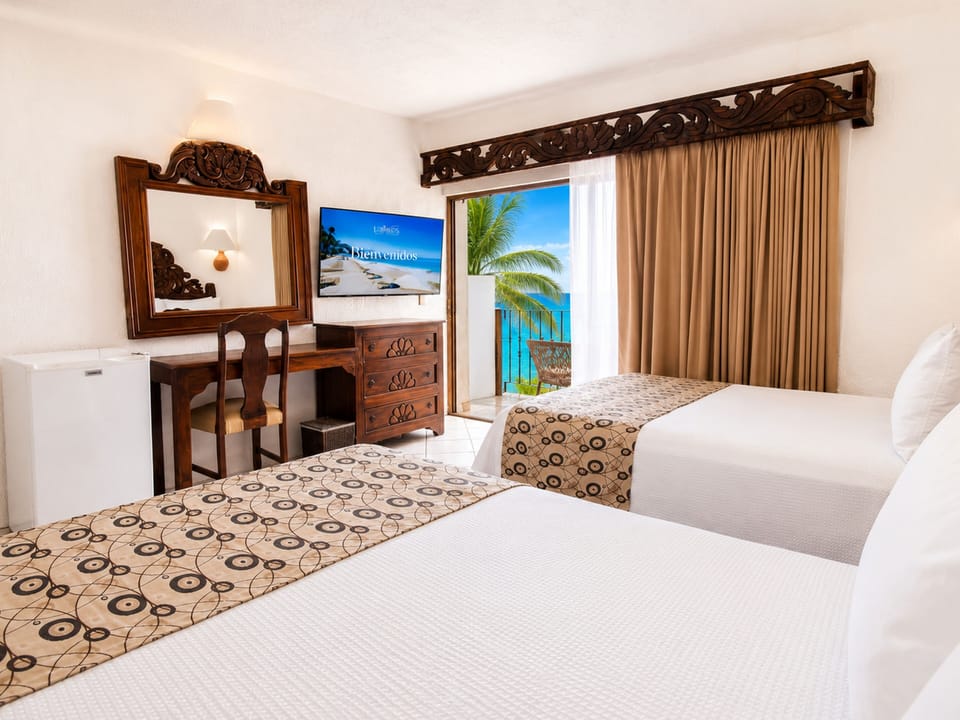 Superior Room, Partial Sea View | In-room safe, iron/ironing board, WiFi (free), bed sheets