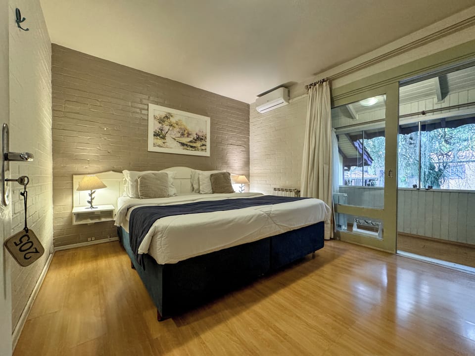Suite, Balcony | Minibar, desk, blackout drapes, rollaway beds