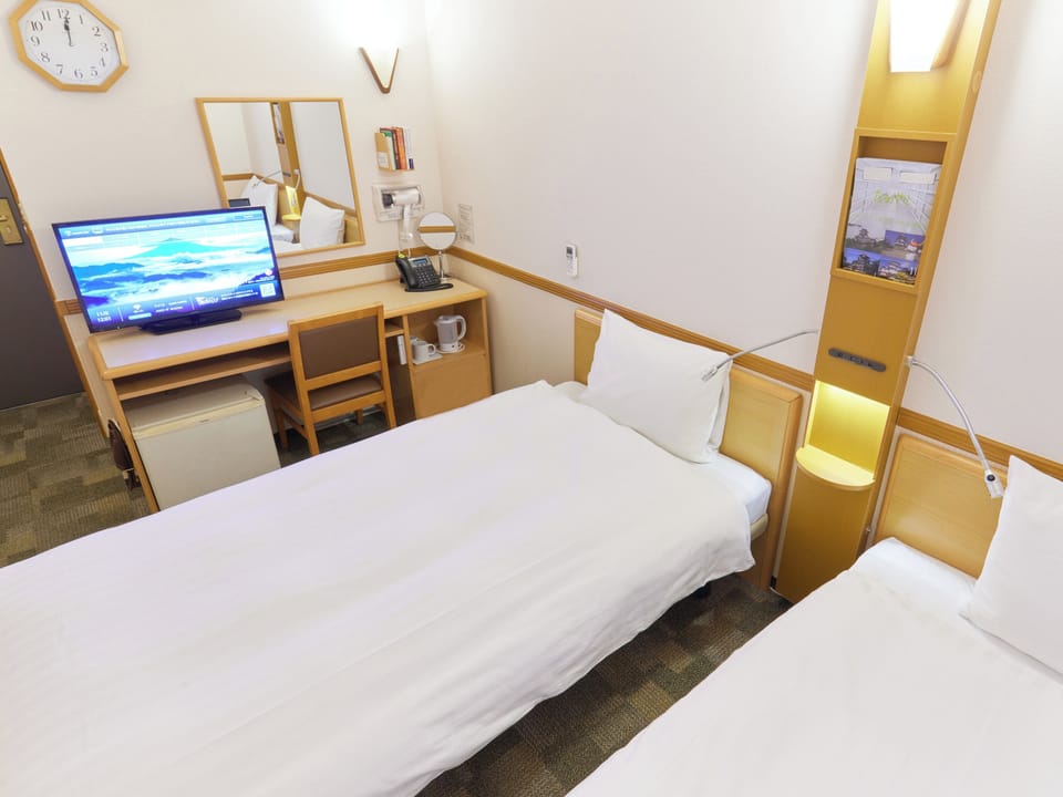 Desk, blackout drapes, WiFi (free), bed sheets