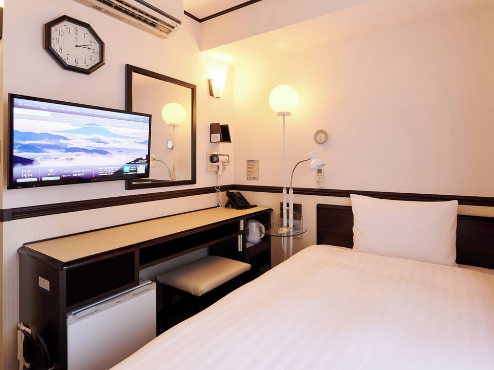 Desk, laptop workspace, free WiFi, bed sheets
