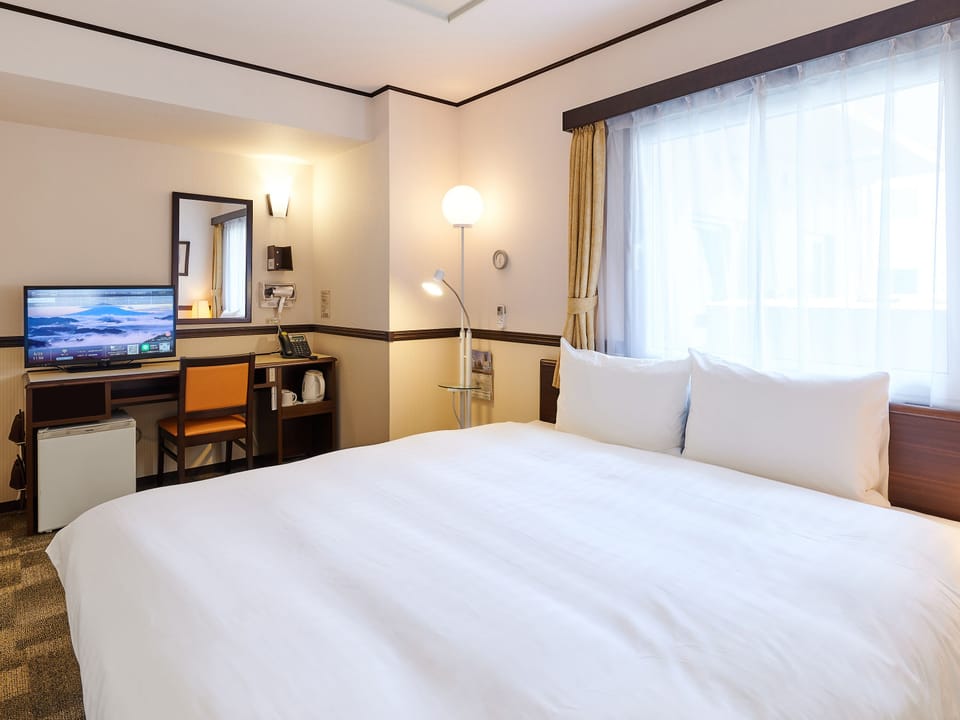 Desk, blackout drapes, WiFi (free), bed sheets