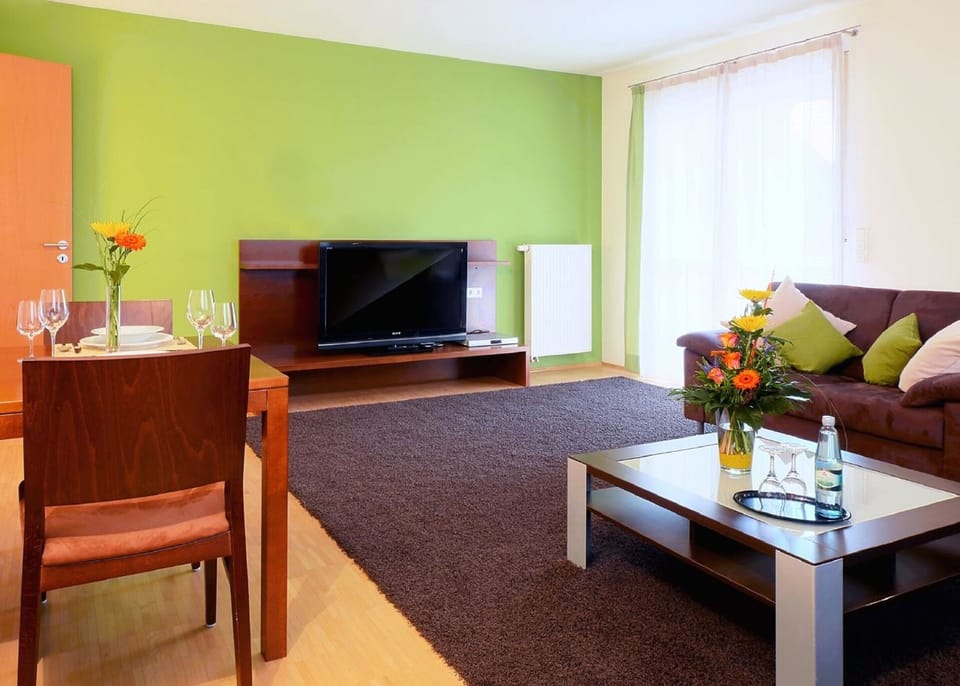 30-inch flat-screen TV with cable channels, first-run movies