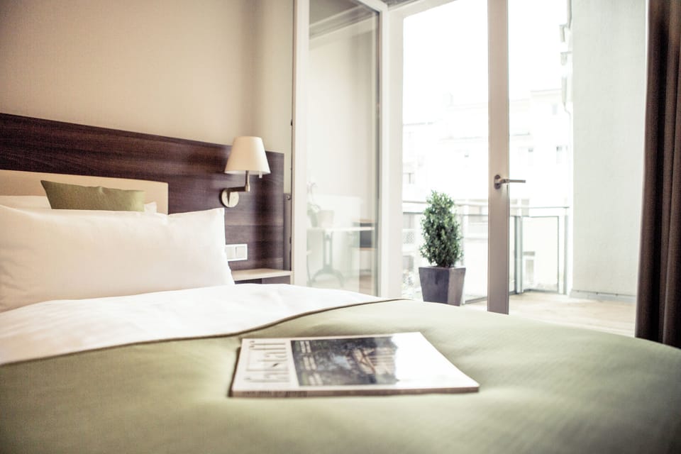 Deluxe Double Room, Non Smoking, Balcony | Minibar, in-room safe, desk, soundproofing