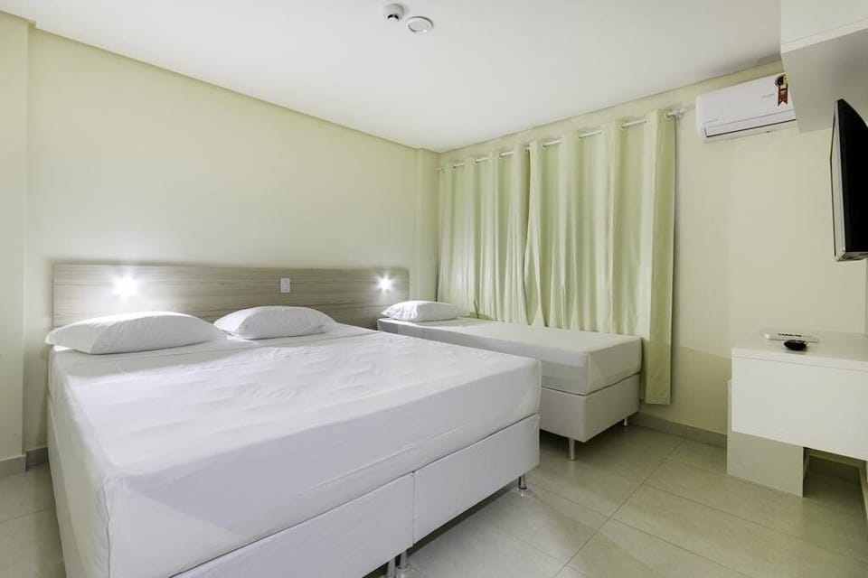 Executive Triple Room | 1 bedroom, premium bedding, minibar, blackout drapes