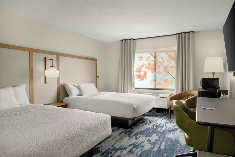 Premium bedding, pillowtop beds, desk, laptop workspace