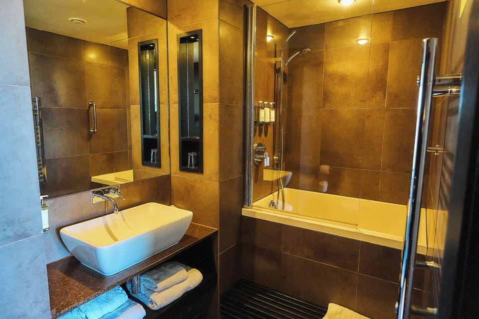V Residence | Bathroom | Designer toiletries, hair dryer, bathrobes, soap