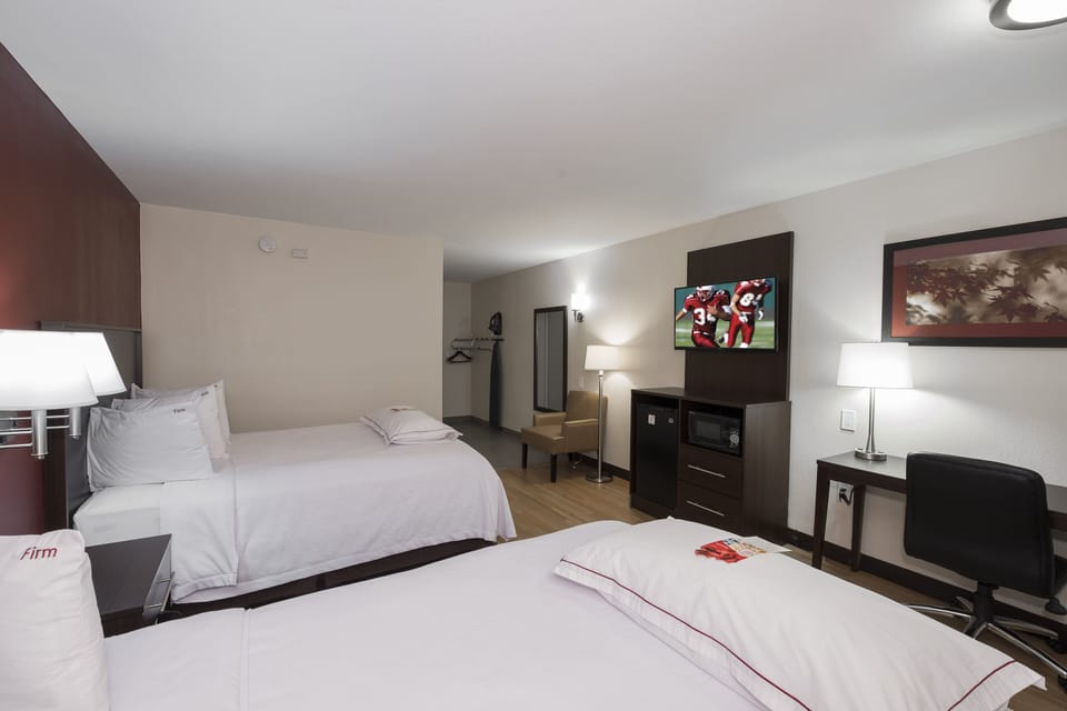 Premium Room, 2 Queen Beds (Upgraded Bedding & Snack, Smoke Free) | Desk, laptop workspace, blackout drapes, iron/ironing board