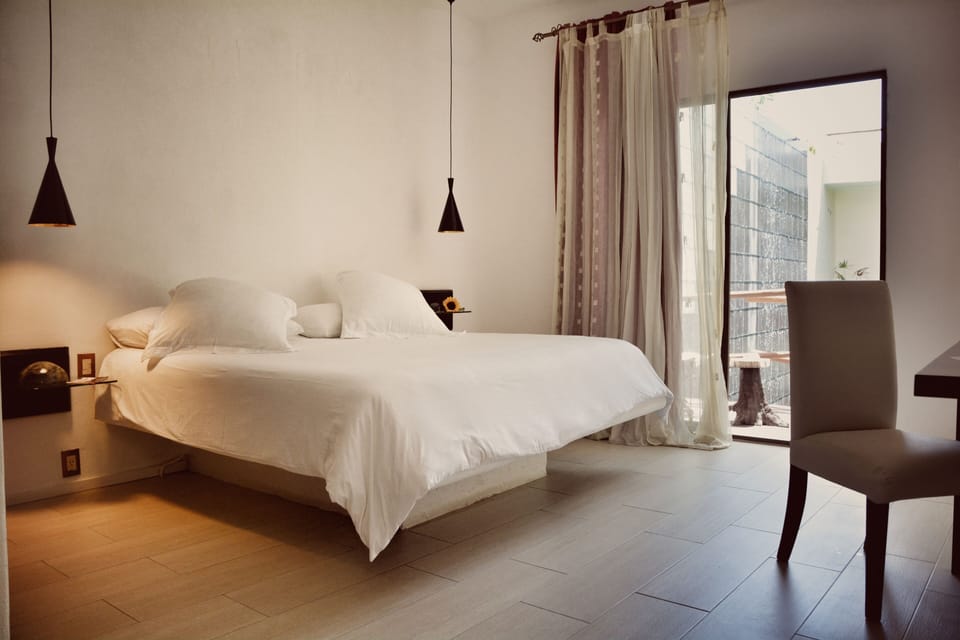 Deluxe Double Room, 1 King Bed, Balcony, Pool View | Minibar, in-room safe, individually decorated, desk