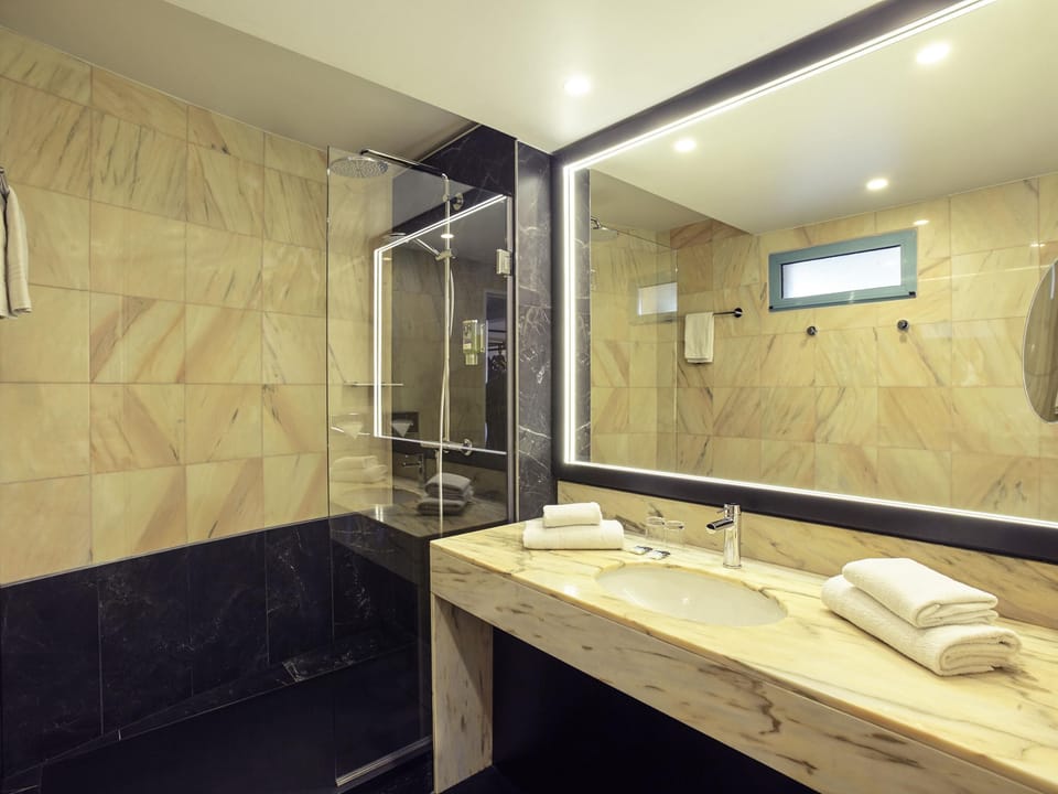 Eco-friendly toiletries, hair dryer, towels