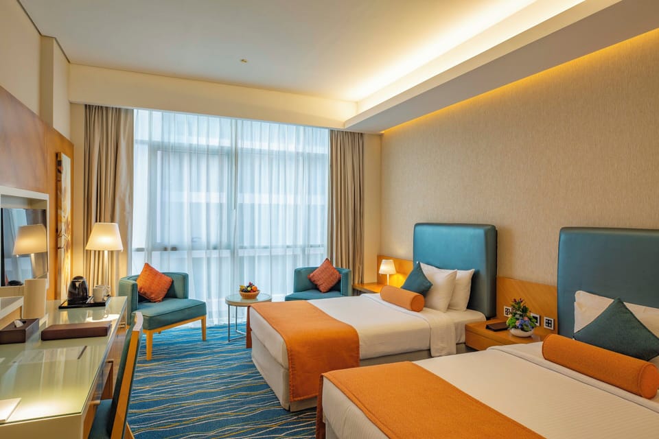 Superior Twin Room | Minibar, in-room safe, desk, blackout drapes