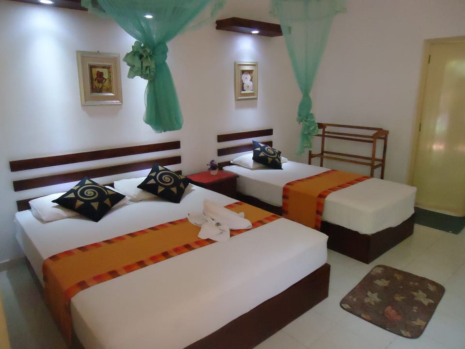 Triple AC Room | Premium bedding, in-room safe, desk, iron/ironing board