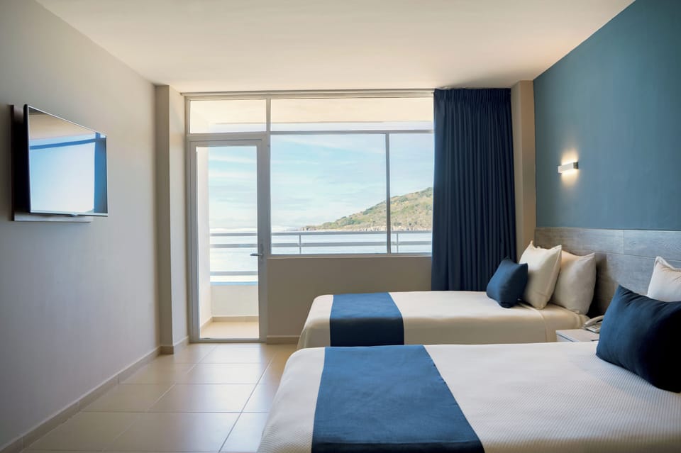 Standard Room, Ocean View | In-room safe, iron/ironing board, free cribs/infant beds, rollaway beds