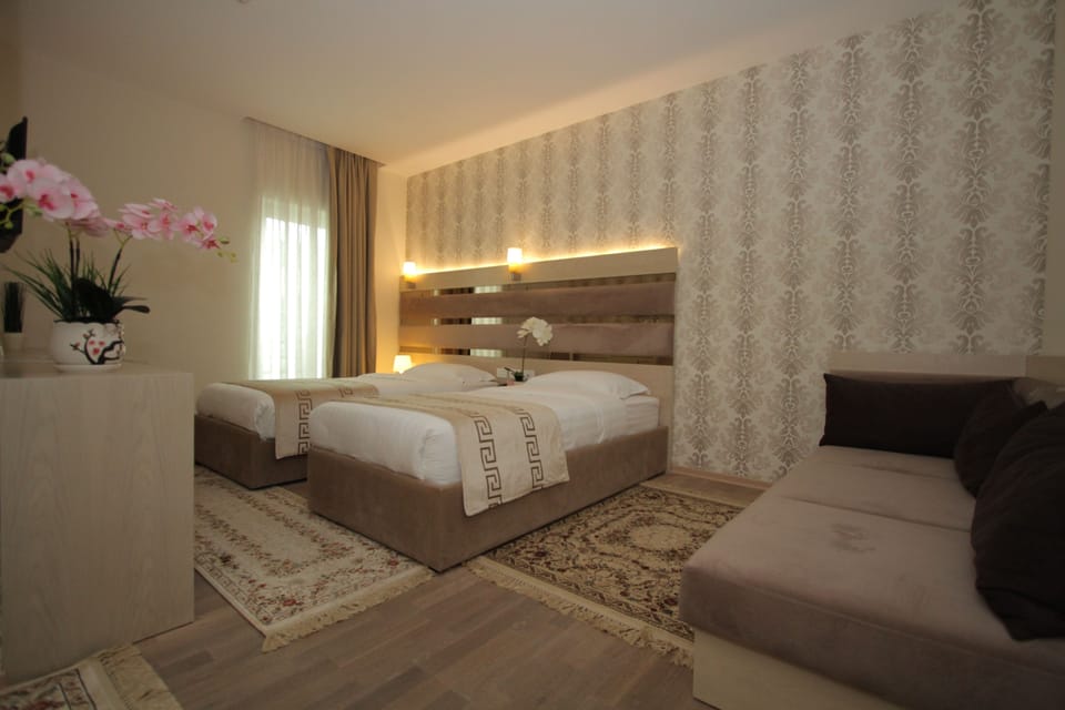 Twin Room | Minibar, in-room safe, desk, soundproofing