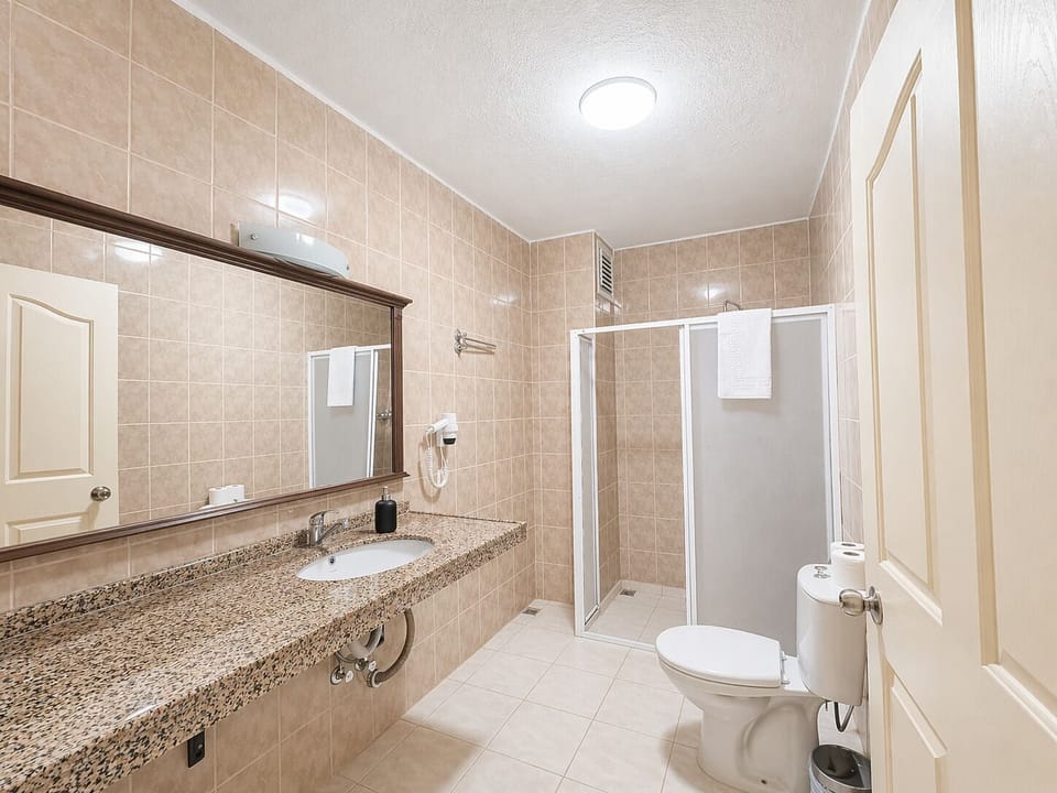 Family Suite, 2 Bedrooms | Bathroom | Shower, free toiletries, hair dryer, slippers