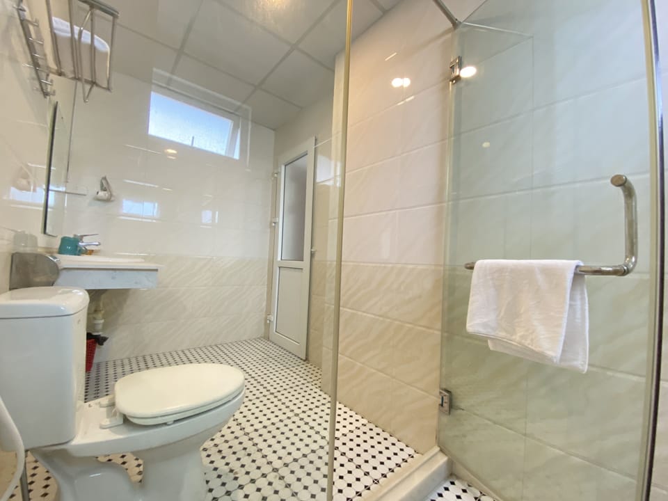 Shower, free toiletries, hair dryer, slippers