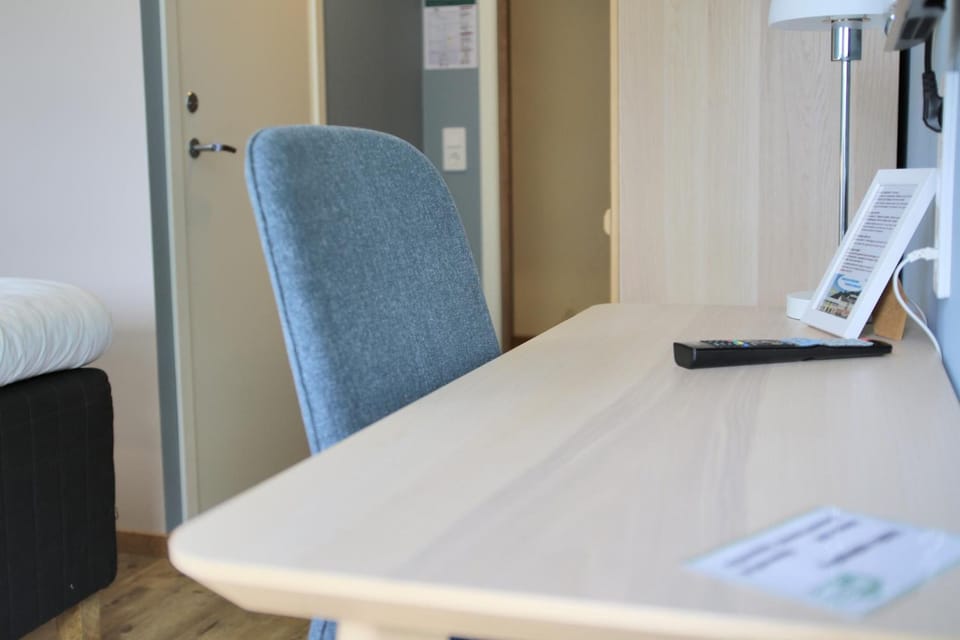 Desk, blackout drapes, soundproofing, free WiFi