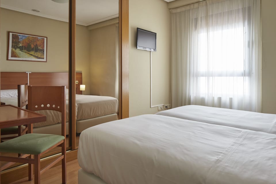 Double Room | Desk, blackout drapes, free cribs/infant beds, free WiFi