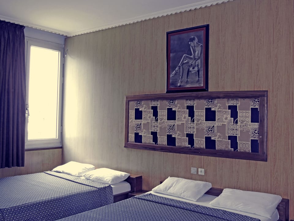 Economy Room | Desk, blackout drapes, free WiFi