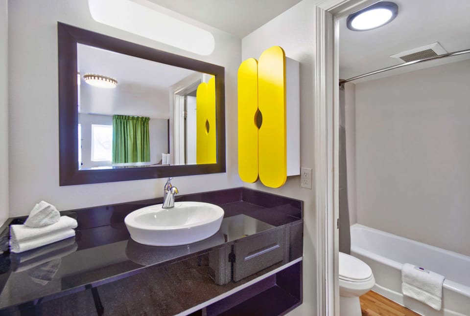 Studio, 1 King Bed, Kitchenette | Bathroom | Free toiletries, hair dryer, towels, soap