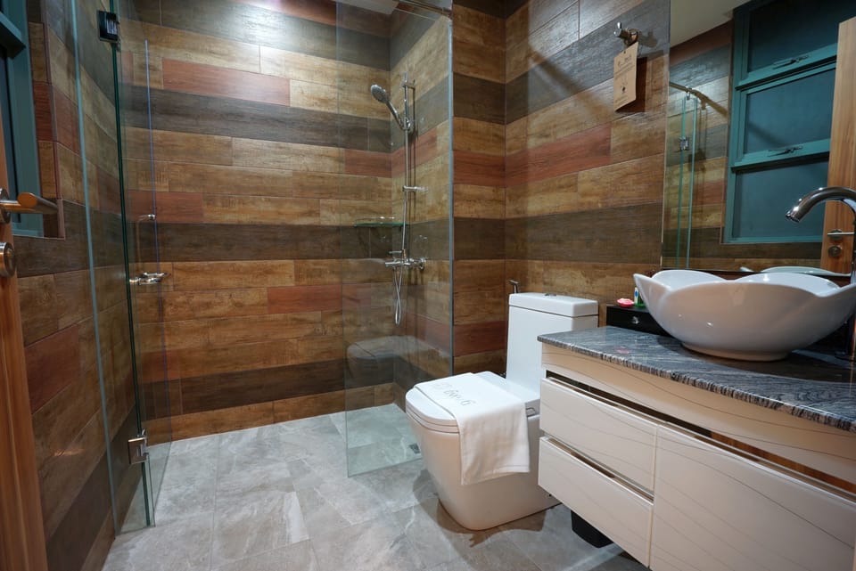 Shower, free toiletries, hair dryer, slippers
