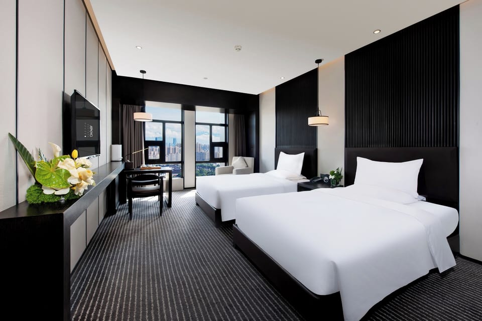 Twin Room | 1 bedroom, in-room safe, desk, blackout drapes