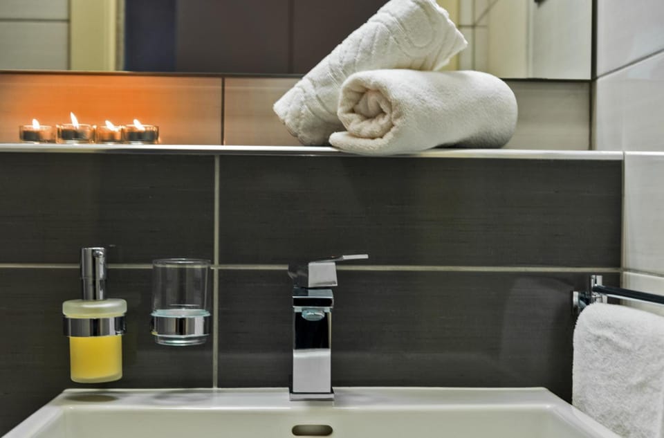 Shower, free toiletries, hair dryer, slippers