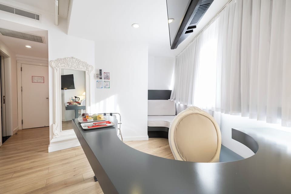 Deluxe Room, 1 Double Bed | Living area | Flat-screen TV, DVD player